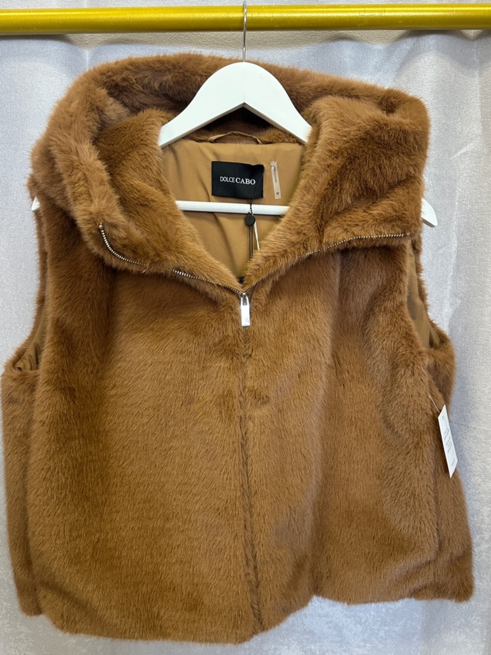 New with tags. Dolce Cabo faux fur vest with hood. Camel